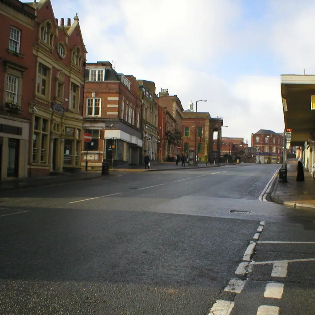 Red-brick and stone buildings along Yorkshire Street in Oldham town centre, in a 2003 photograph