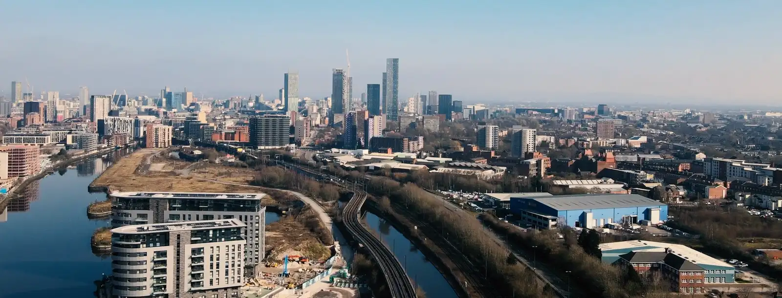 The Manchester city centre skyline from the air, looking across the River Irwell from Salford