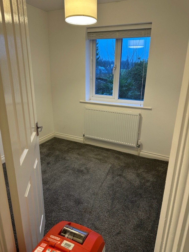 An empty bedroom after cleaning, from the Sage Cleans work gallery